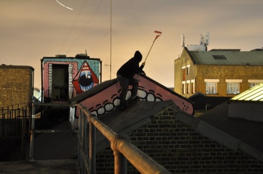 British artist Sweet Toof, known for toothy figures, is getting a solo show at Factory Fresh in Brooklyn. He is shown here redecorating a rooftop.